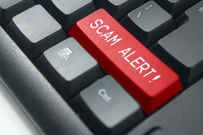 Close-up of keyboard with red "SCAM ALERT" key.