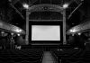 movie screen in an all black theater