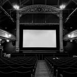 movie screen in an all black theater