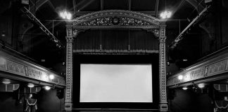 movie screen in an all black theater