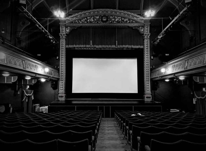 movie screen in an all black theater