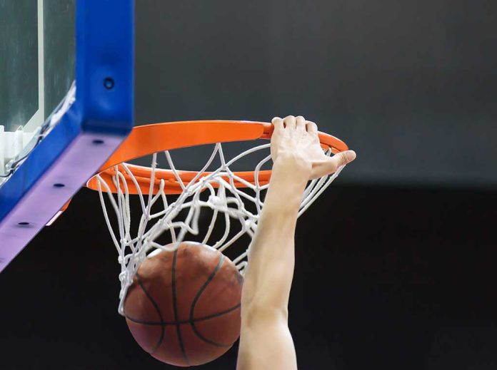 basketball next with player dunking the ball