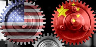 Interlocking gears with USA and China flags.