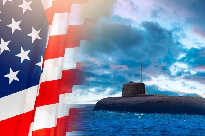 American flag and submarine at sea under a cloudy sky.