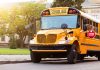 Yellow school bus with extended stop sign.