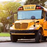 Yellow school bus with extended stop sign.