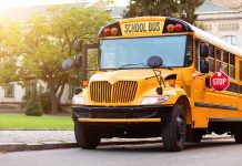 Yellow school bus with extended stop sign.