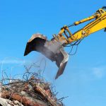 heavy machinery attempting to move construction debris