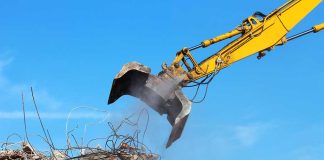 heavy machinery attempting to move construction debris