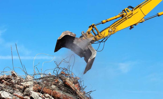 heavy machinery attempting to move construction debris