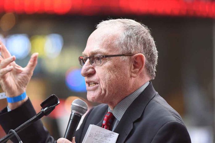 Lawyer Alan Dershowitz at a microphone