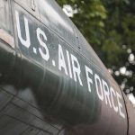 U.S. Air Force plane with trees in background.