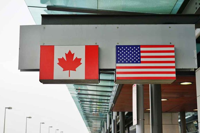 Canada and U.S. flags at an airport.