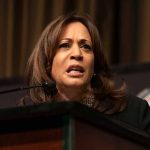 Kamala Harris makes a face while at a podium