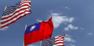 American and Taiwanese flags waving in the sky.