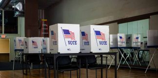 Voting booths set up in a room.