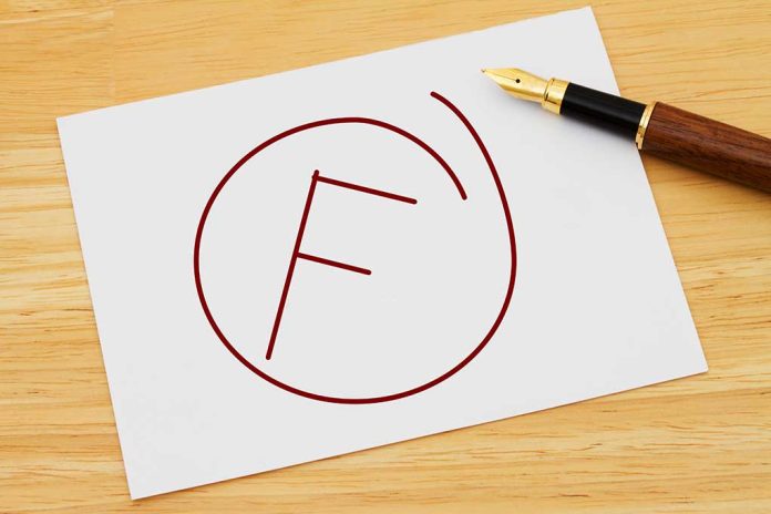 Fail grade written on paper with a pen.