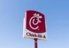 Chick-fil-A sign against a blue sky