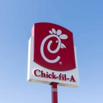 Chick-fil-A sign against a blue sky