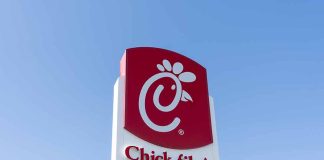 Chick-fil-A sign against a blue sky