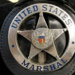 United States Marshal badge close-up.