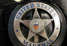 United States Marshal badge close-up.