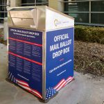 Official mail ballot drop box outside building.