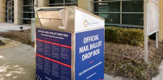 Official mail ballot drop box outside building.