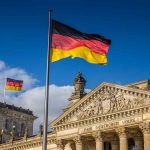 German flags at the Reichstag building in Berlin.