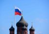 Russian flag next to church domes.