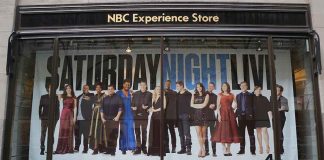 poster of the Saturday Night Live cast in a store window