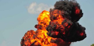 Large explosion with fireball and smoke cloud.