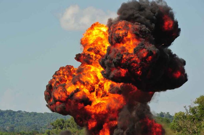 Large explosion with fireball and smoke cloud.