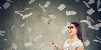 Woman holding phone surrounded by falling money