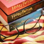 Harry Potter books with round glasses on fabric.