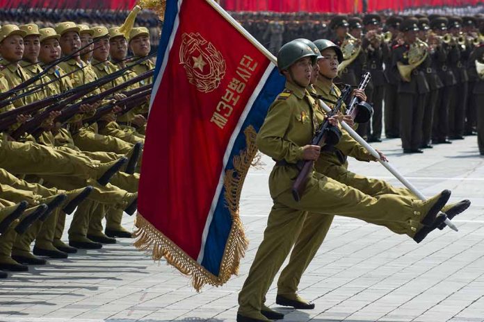 Soldiers marching with flag in military parade.