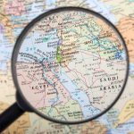 Magnifying glass over the Middle East and Egypt.