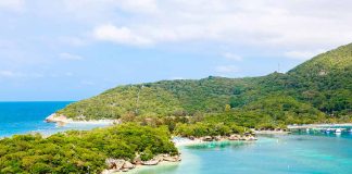 Tropical bay with turquoise water and lush hills