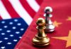 Chess pawns on USA and China flags.