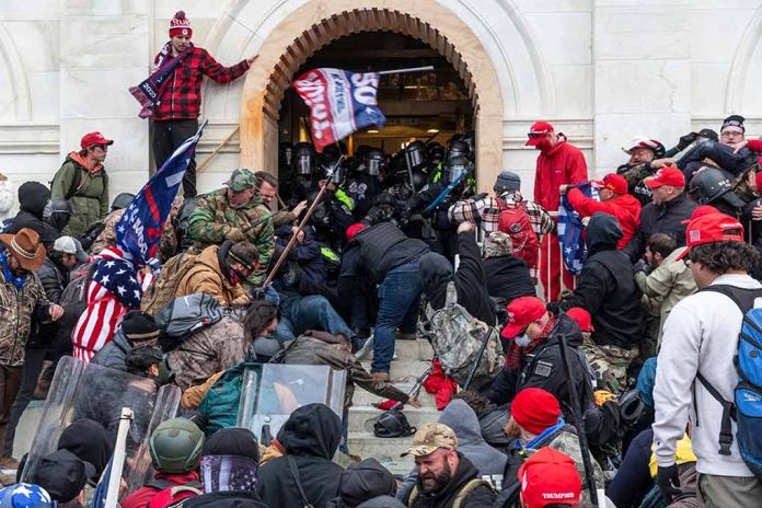 Crowd at building entrance, people wearing red hats.