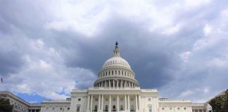 United States Capitol building under cloudy sky