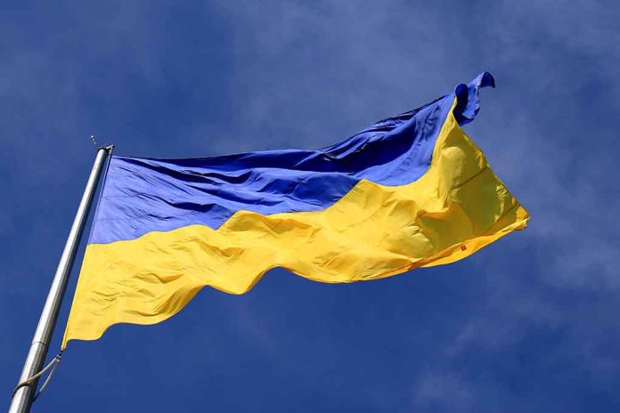 Ukrainian flag waving against a blue sky.