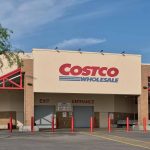 Costco Wholesale store exterior with entrance and exit signs.