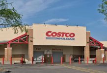 Costco Wholesale store exterior with entrance and exit signs.