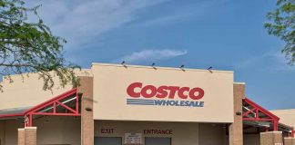 Costco Wholesale store exterior with entrance and exit signs.