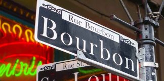 Bourbon and St Louis street signs with neon lights