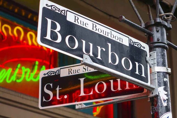 Bourbon and St Louis street signs with neon lights