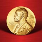 Gold Nobel Prize medal on red background.