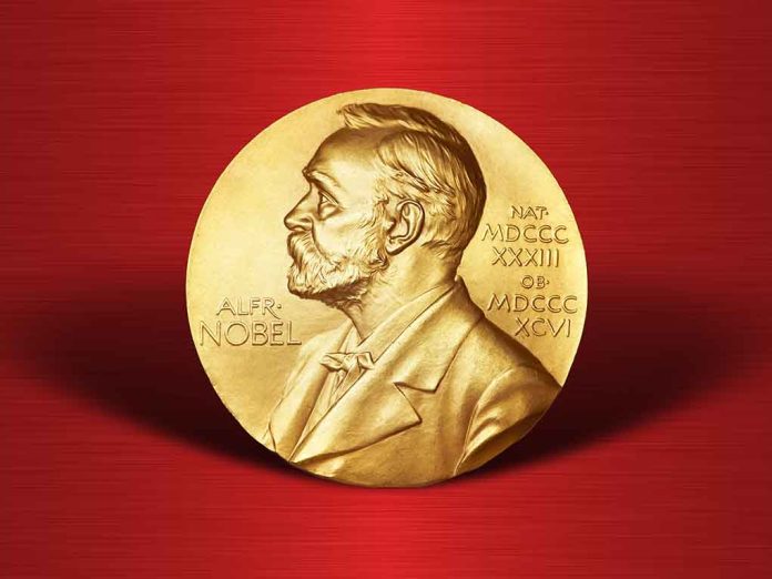 Gold Nobel Prize medal on red background.