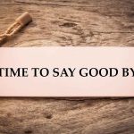 Sign reads "TIME TO SAY GOOD BYE" on wood.